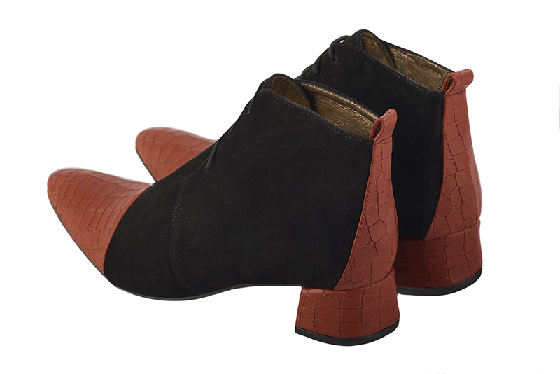 Women's terracotta orange and matt black elegant ankle boots, with laces at the front. Tapered toe. Low flare heels - Rear view